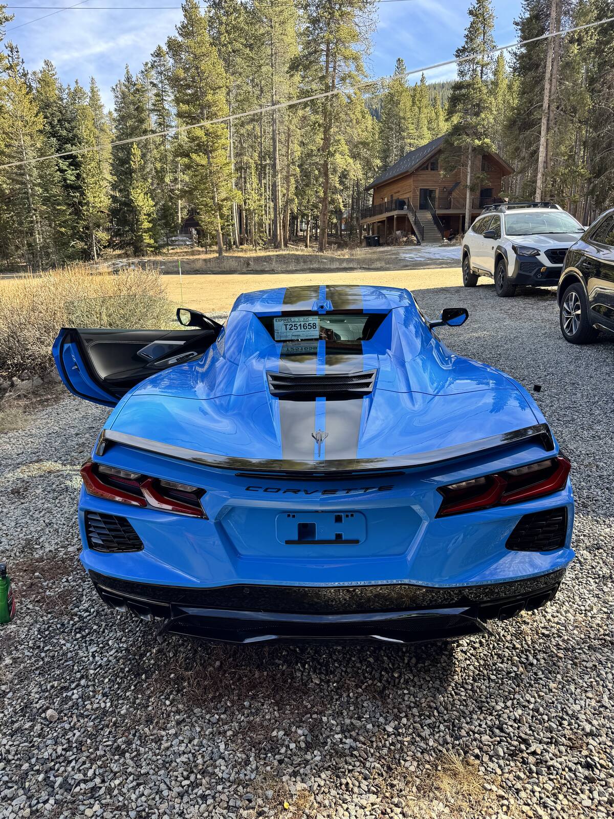 A freshly detailed blue Chevrolet Corvette C8 in the Vail, Colorado mountains